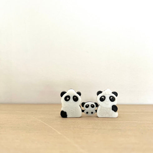 Baby panda among the pandas